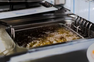 industrial deep fryer with bubbling oil in restaur 2026 03 18 09 46 24 utc