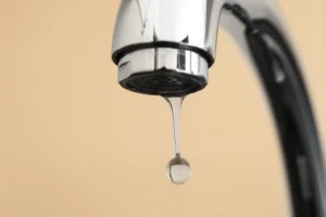 water drop suspended from shiny silver tap 2026 03 26 08 10 47 utc